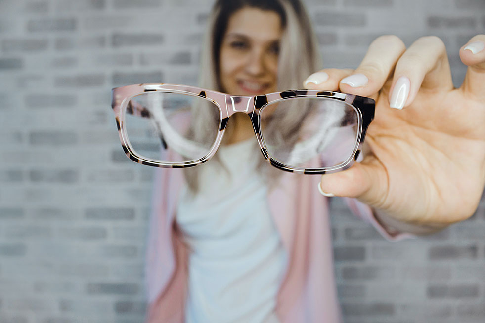 woman showing glasses